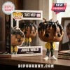 Juice WRLD 999 Funko Pop Rocks vinyl figure with signature dreadlocks, yellow jacket, and patterned pants on a wood desk.