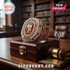Kappa Alpha Psi fraternity ring in gold with red enamel, diamonds, and crest, sitting on a wooden box near a gavel.!