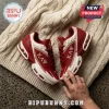 Kappa Alpha Psi crimson and white sneakers with Greek lettering and 1911 text resting on a cream cable knit blanket.!