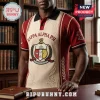 Kappa Alpha Psi Embroidered Crest Polo Shirt with red and cream patterned knit fabric and a formal library background.