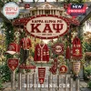 Kappa Alpha Psi hanging wind chime decor with fraternity crests, red cardigan, cap, and metallic tubes in garden setting.!