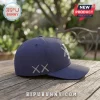 Navy blue baseball cap with white embroidered XX cross symbols on the side and a partial logo on the front panel.!