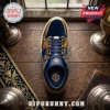 Knights of Columbus themed sneaker in blue velvet and gold metallic leather with custom KofC crests on a wooden table.!
