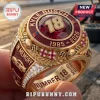 Gold NASCAR tribute ring for Kyle Busch featuring red stone, number 18, checkered flags, and In Memory inscription.!