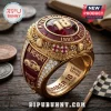 Gold NASCAR Kyle Busch championship ring with red enamel, 18 logo, checkered flags, and text reading In Memory 1985-2026.!