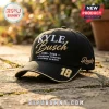 Black baseball cap featuring gold and white Kyle Busch embroidery, 18 racing number, and Rowdy text on stone background.!
