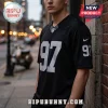 Man wearing a black V-neck football jersey with the number 97 in white and silver on the chest and sleeves.!