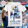 Lionel Messi 2006-2026 World Cup white t-shirt featuring graphic illustration of Messi, sunburst, and city landmarks.
