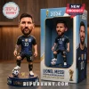 Lionel Messi bobblehead in Argentina jersey with number 10, standing on a FIFA World Cup 2026 base with box packaging.!