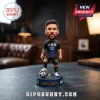 Lionel Messi bobblehead figure wearing a black Argentina soccer kit with number 10, standing on a blue trophy base.!