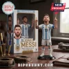 Lionel Messi vinyl figure in Argentina jersey pointing skyward, displayed next to its branded cardboard window box.!