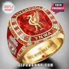 Gold Liverpool FC championship ring with a large red center stone, gold Liverbird emblem, and YNWA text engraving.!