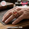 Gold Liverpool FC championship ring featuring a red stone, Liver bird emblem, and YNWA inscription on a male finger.!