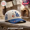 Los Angeles Dodgers Dia De Los Dodgers Baseball Cap 2026 featuring cream fabric, blue brim, and floral calavera embroidery.