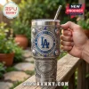 Los Angeles Dodgers stainless steel Yeti tumbler with blue gems, baseball motifs, and stadium engraving on a wooden deck.!