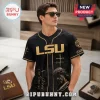 LSU Tigers Jesus Saved My Life baseball jersey in black with gold accents, featuring cross graphics and spiritual text.