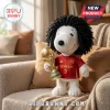 Marc Cucurella Spain Snoopy plush toy with curly black hair, wearing a red Spain soccer jersey holding a gold trophy.