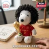 Marc Cucurella Spain Snoopy plush toy featuring dark curly hair and a red Spanish jersey holding a gold trophy replica.