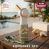 Margaritaville Parrothead LED handheld fan featuring a white body with ornate tropical teal and gold artwork on a table.