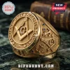 Masonic Gold Plated Square and Compass Men's Ring featuring detailed engravings of anchors and stars on a marble surface.
