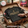 Black athletic t-shirt featuring Mexico text, Aztec patterns, a central mask graphic, and a Mexican flag on the sleeve.!