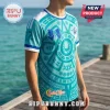 Teal Sailor Moon jersey featuring circular geometric patterns, a blue chest bow, and white trim against an ocean backdrop.!