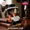 Crochet Michael Jackson doll wearing a black fedora and red jacket, holding a sign with You are not alone lyrics.!