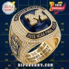 Gold Michigan Wolverines championship ring featuring a navy stone, diamond accents, and text reading 2026 NCAA Final Four.!