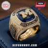 Gold Michigan Wolverines NCAA Final Four 2026 championship ring with blue stone, diamond accents, and engraved text.!