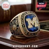Gold Michigan Wolverines 2026 Final Four championship ring with a large blue center stone and diamond-encrusted M logo.!