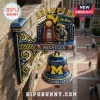 Michigan Wolverines wall-mounted bell with NCAA championship trophy, mascot figurine, and basketball motifs in blue and gold.!
