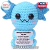 Light blue crocheted axolotl plush toy with black plastic eyes, pink cheeks, holding a sign with inspirational text.!