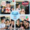 Blue crocheted axolotl plush holding a sign with motivational text about bravery and strength.!