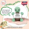Small crochet turtle toy in pastel green and brown held in a palm, displaying a white card reading You are Turtle-y Awesome.!