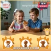 Children sitting at a wooden table holding a brown crochet highland cow doll with a printed encouragement message tag.!