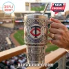 Minnesota Twins Yeti tumbler featuring engraved stadium, baseball motifs, silver finish, and blue and red gem accents.!