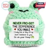 Light green crochet frog plush holding a sign that reads Never Fro-get The Difference You Make with motivational text.!