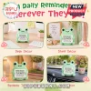 Crocheted light green frog plush holding a sign that reads Never Fro-get the difference you make with positive text.!