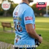Light blue rugby jersey with number 26, Tooheys branding, and Champions text worn by a man holding binoculars outdoors.!