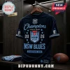 Navy blue NSW Blues 2026 State of Origin champion t-shirt with light blue embroidery and stars on a wooden hanger.!