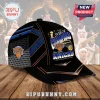 New York Knicks 2025-26 NBA Champions baseball cap with blue, orange, and black graphics on a wooden surface.!