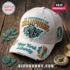 White distressed baseball cap with 2026 New York Liberty Commissioner's Cup Champions embroidery on a wood surface.!