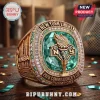 New York Liberty 2026 Commissioner's Cup championship ring with teal center stone, gold plating, and surrounding crystals.!