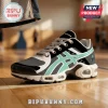 New York Liberty WNBA sneaker featuring teal stripes, black mesh, white accents, and team logo on basketball court floor.!