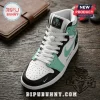 High-top basketball sneaker in white, black, and mint green leather with white laces and a custom NY torch emblem logo.!
