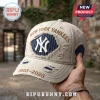 New York Yankees 1903-2026 Distressed Beige Baseball Cap featuring embroidered team text and navy pinstripe accents.