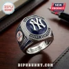 New York Yankees 27x Champions Ring featuring a large blue faceted stone, silver band, and team branding.