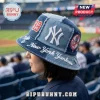 New York Yankees Distressed Denim Bucket Hat with white embroidered NY logo, number 99, and team patch on blue fabric.
