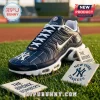 New York Yankees navy blue athletic sport shoes featuring white pinstripes and team logos on a baseball field background.