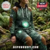 Person wearing a green fern-patterned hoodie and sweatpants with brown quilted elbow and knee patches and One.nz branding.!